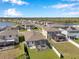 Aerial view of a home showing its screened-in lanai and spacious backyard with fence at 2934 Living Coral Dr, Odessa, FL 33556