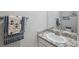 Charming bathroom featuring granite countertop, stainless faucet, and nautical-themed decorations at 2934 Living Coral Dr, Odessa, FL 33556