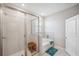 Bathroom featuring a glass-enclosed shower, a soaking tub, and tile surround at 2934 Living Coral Dr, Odessa, FL 33556