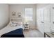 Inviting bedroom with a cozy bed, side table, and plenty of natural light at 2934 Living Coral Dr, Odessa, FL 33556