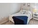 Inviting bedroom with a cozy bed, side table, and plenty of natural light at 2934 Living Coral Dr, Odessa, FL 33556