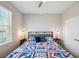 Comfortable bedroom with neutral walls, and stylish nautical-themed comforter at 2934 Living Coral Dr, Odessa, FL 33556