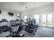 Community fitness center with state-of-the-art cardio machines and multiple televisions at 2934 Living Coral Dr, Odessa, FL 33556