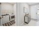 Laundry room next to the entrance, furnished with modern washer and dryer, offering convenience at 2934 Living Coral Dr, Odessa, FL 33556