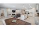 Open-concept living space boasts a fireplace, large TV, and an eat-in kitchen at 2934 Living Coral Dr, Odessa, FL 33556