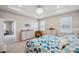 Spacious main bedroom featuring a tray ceiling, neutral walls, and ample closet space at 2934 Living Coral Dr, Odessa, FL 33556