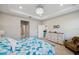 Spacious main bedroom featuring a tray ceiling, neutral walls, and ample closet space at 2934 Living Coral Dr, Odessa, FL 33556