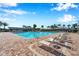 Community pool with plenty of lounge chairs perfect for relaxing at 2934 Living Coral Dr, Odessa, FL 33556