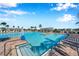 Large community pool featuring a chair lift and clear blue water at 2934 Living Coral Dr, Odessa, FL 33556