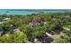 Expansive home nestled among mature trees, offering serene privacy and water views at 3010 82Nd N Way, St Petersburg, FL 33710