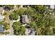 Aerial view of a home surrounded by lush landscaping and greenery at 3010 82Nd N Way, St Petersburg, FL 33710