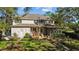 Backyard features a hot tub, screened-in porch, and meticulously landscaped grounds at 3010 82Nd N Way, St Petersburg, FL 33710