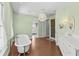 Elegant bathroom featuring a standalone tub, white vanity, and stylish lighting fixture creating a spa-like atmosphere at 3010 82Nd N Way, St Petersburg, FL 33710