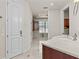 Bathroom featuring a luxurious countertop, storage cabinets, and a doorway to a large closet at 3010 82Nd N Way, St Petersburg, FL 33710