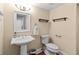 Practical half bathroom featuring a pedestal sink and modern fixtures providing an inviting space for guests at 3010 82Nd N Way, St Petersburg, FL 33710
