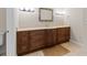 Bathroom featuring vanity with marble countertop and dark wood cabinetry and tile flooring at 3010 82Nd N Way, St Petersburg, FL 33710