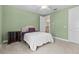 Comfortable bedroom featuring soft carpeting, a ceiling fan, and a neutral color scheme at 3010 82Nd N Way, St Petersburg, FL 33710