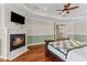 Primary bedroom with cozy fireplace, providing a warm and inviting atmosphere at 3010 82Nd N Way, St Petersburg, FL 33710