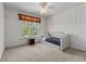 Inviting bedroom with a cozy daybed, natural light, and a view of the outdoors at 3010 82Nd N Way, St Petersburg, FL 33710