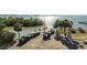Aerial view of a boat ramp and docking area, featuring parked trucks and boats on trailers at 3010 82Nd N Way, St Petersburg, FL 33710
