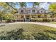 Elegant two-story home with inviting front porch and well-manicured landscaping at 3010 82Nd N Way, St Petersburg, FL 33710