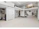A clean and functional garage with ample space, shelving, and a convenient utility sink at 3010 82Nd N Way, St Petersburg, FL 33710