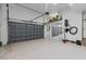 Spacious garage with a large roll-up door and ample space for parking and storage at 3010 82Nd N Way, St Petersburg, FL 33710
