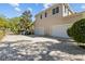 Spacious garage and parking area featuring a classic brick paver driveway at 3010 82Nd N Way, St Petersburg, FL 33710
