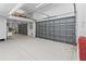 Spacious garage with high ceilings and two large roll-up doors, ideal for storage at 3010 82Nd N Way, St Petersburg, FL 33710