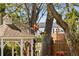 Elegant gazebo and partial view of a home and lake beyond it at 3010 82Nd N Way, St Petersburg, FL 33710