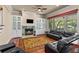 Inviting living room with fireplace and built-in cabinets, perfect for cozy evenings and entertaining at 3010 82Nd N Way, St Petersburg, FL 33710