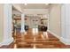 Bright living room featuring hardwood floors, decorative columns, and open floor plan to the kitchen at 3010 82Nd N Way, St Petersburg, FL 33710
