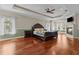 Spacious main bedroom featuring hardwood floors, fireplace and tray ceiling at 3010 82Nd N Way, St Petersburg, FL 33710