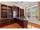 Home office featuring custom built-ins and a granite-topped desk, ideal for a productive work environment at 3010 82Nd N Way, St Petersburg, FL 33710