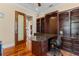 Well-appointed home office boasting custom built-in shelving and desk, providing a perfect workspace at 3010 82Nd N Way, St Petersburg, FL 33710