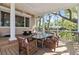 Inviting screened porch features a dining area and comfortable seating, perfect for enjoying the outdoors at 3010 82Nd N Way, St Petersburg, FL 33710