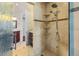 Modern shower with tile surround, built-in shelving, and glass door in Primary bathroom at 3010 82Nd N Way, St Petersburg, FL 33710