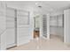 Spacious walk-in closet with custom shelving and drawers, providing ample storage and organization at 3010 82Nd N Way, St Petersburg, FL 33710