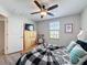 Inviting bedroom with natural light, featuring wood-look flooring and a peaceful ambiance, offering a restful retreat at 32101 Goddard Dr, Wesley Chapel, FL 33543