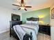 Comfortable bedroom featuring an accent wall and a TV, creating a relaxing and functional living space at 32101 Goddard Dr, Wesley Chapel, FL 33543