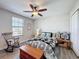Cozy bedroom with natural light, showcasing a comfortable bed and charming decor, perfect for relaxation at 32101 Goddard Dr, Wesley Chapel, FL 33543