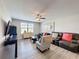 Comfortable living room featuring neutral walls, ceiling fan, and ample seating creating a relaxing atmosphere at 32101 Goddard Dr, Wesley Chapel, FL 33543