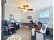 Bright office space featuring neutral walls, wood floors, ceiling fan, and natural light from the window at 32101 Goddard Dr, Wesley Chapel, FL 33543
