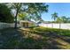 Spacious backyard with full fence and mature trees at 3451 Pine St, Dunedin, FL 34698