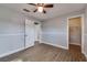 Light filled bedroom showcases wood-look floors, modern style, and attached walk-in closet at 3451 Pine St, Dunedin, FL 34698