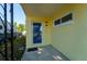 Front door with storm door and side window at 3451 Pine St, Dunedin, FL 34698