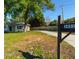 Charming home with mature trees, and spacious front yard at 3451 Pine St, Dunedin, FL 34698