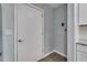 Hallway area showcasing a door to a bedroom and other home features at 3451 Pine St, Dunedin, FL 34698