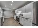 Bright kitchen features stainless steel appliances, granite counters, and white subway tile backsplash at 3451 Pine St, Dunedin, FL 34698