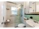 Bathroom featuring modern glass shower with seat, sink and toilet at 3726 Prescott N St, St Petersburg, FL 33713
